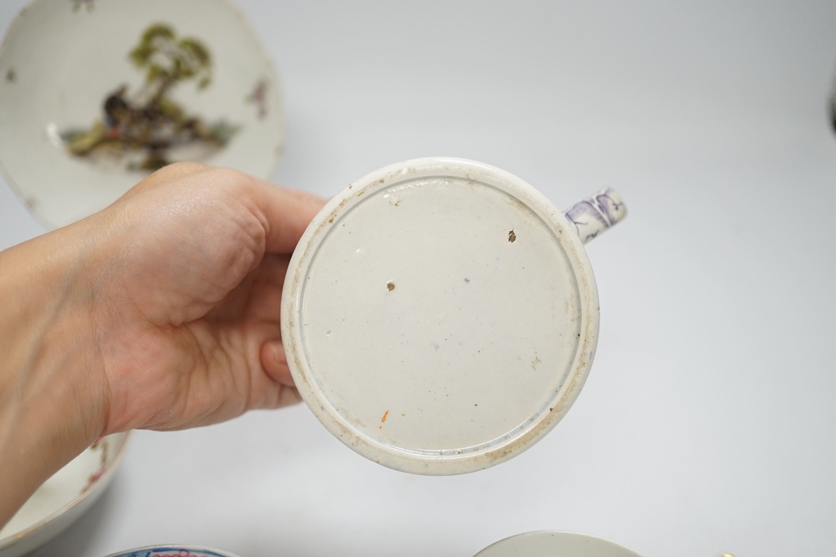 Two Derby porcelain coffee cans and one saucer, a tea bowl, a pearlware mug and a mid 18th century Meissen cup and saucer, tallest mug 8cm high